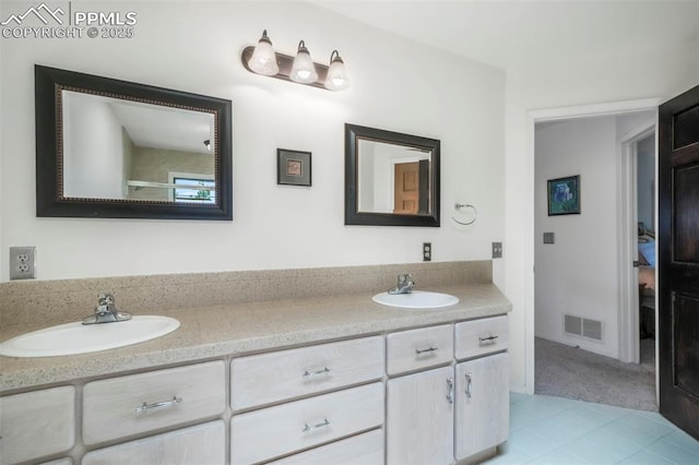 1240 Lone Scout Lookout, Monument, CO 80132 - full bathroom with double vanity and tile patterned flooring