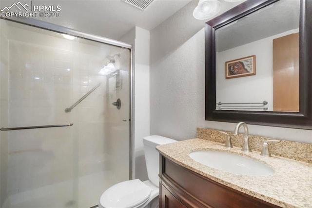 1240 Lone Scout Lookout, Monument, CO 80132 - bathroom with a shower stall, vanity, and a textured wall