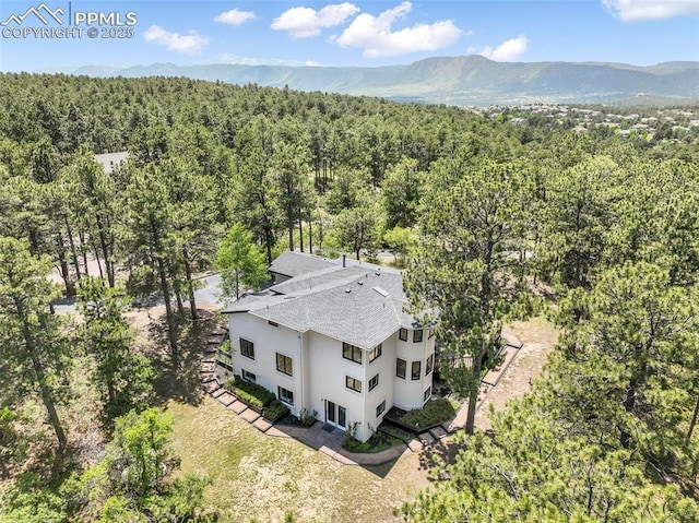 1240 Lone Scout Lookout, Monument, CO 80132 - view from above of property featuring a forest and a mountainous background