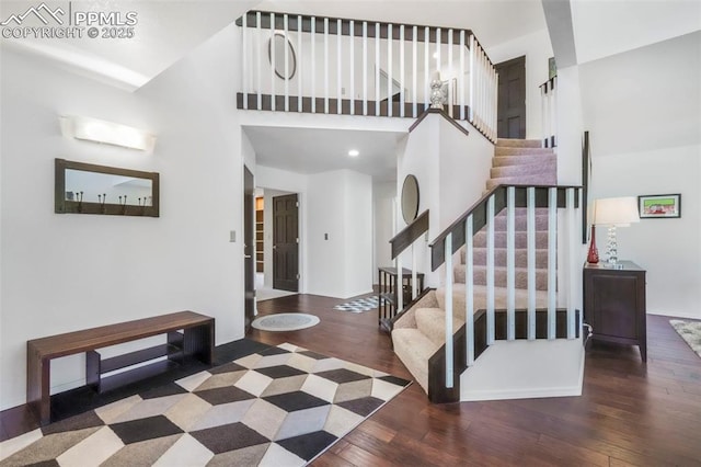 1240 Lone Scout Lookout, Monument, CO 80132 - entrance foyer with hardwood / wood-style flooring, stairs, and a high ceiling