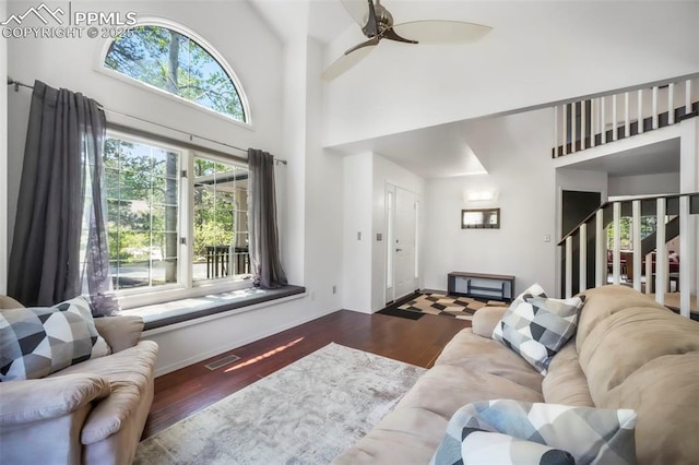 1240 Lone Scout Lookout, Monument, CO 80132 - living room featuring wood finished floors, a towering ceiling, and ceiling fan