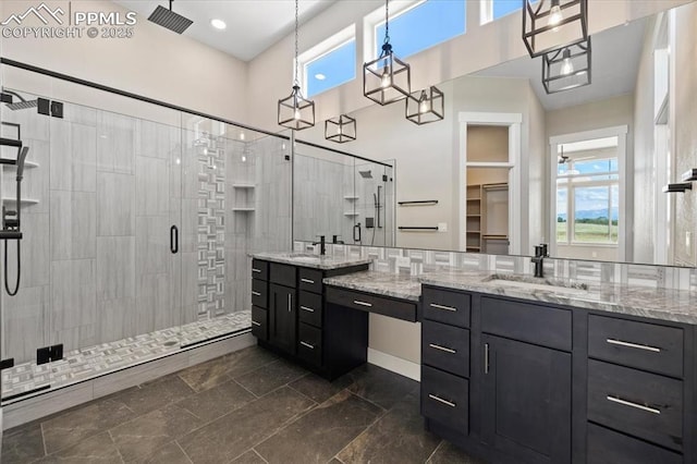 8545 Bailiff Dr, Peyton, CO 80831 - full bathroom featuring a shower stall, vanity, and a towering ceiling