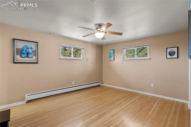 2206 Patrician Way, Colorado Springs, CO 80909 - empty room with a baseboard radiator, a ceiling fan, light wood-style flooring, baseboards, and plenty of natural light