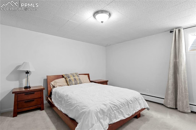 2206 Patrician Way, Colorado Springs, CO 80909 - bedroom featuring light colored carpet and baseboard heating