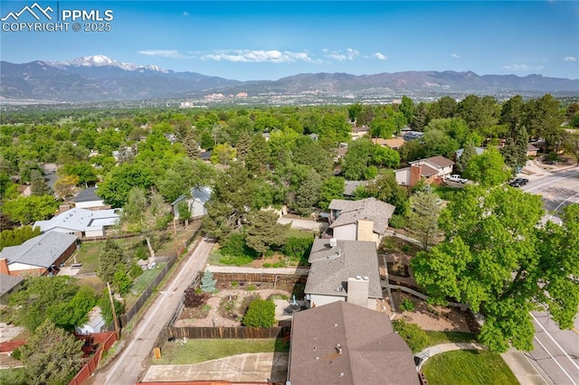 2206 Patrician Way, Colorado Springs, CO 80909 - aerial view of property and surrounding area with a mountainous background and nearby suburban area