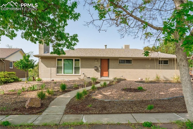 2206 Patrician Way, Colorado Springs, CO 80909 - single story home with a chimney and brick siding