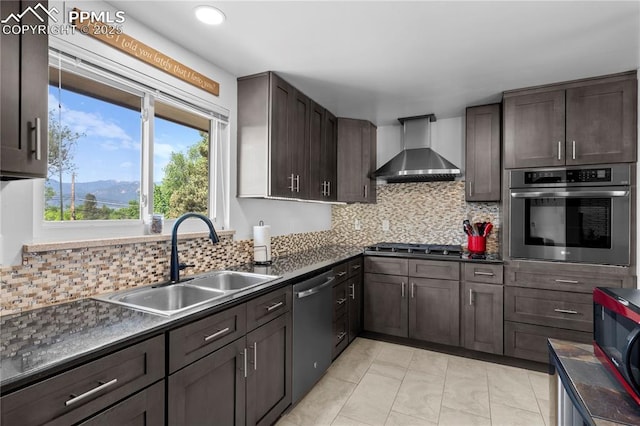 2206 Patrician Way, Colorado Springs, CO 80909 - kitchen with stainless steel appliances, wall chimney range hood, a sink, dark countertops, and recessed lighting