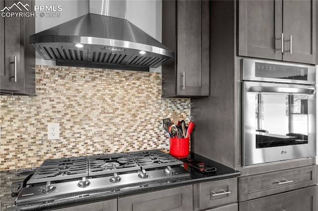 2206 Patrician Way, Colorado Springs, CO 80909 - kitchen with wall chimney exhaust hood, stainless steel appliances, tasteful backsplash, and dark countertops