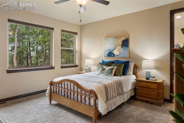 8395 Bar X Ter, Colorado Springs, CO 80908 - bedroom featuring carpet floors, baseboards, and a ceiling fan