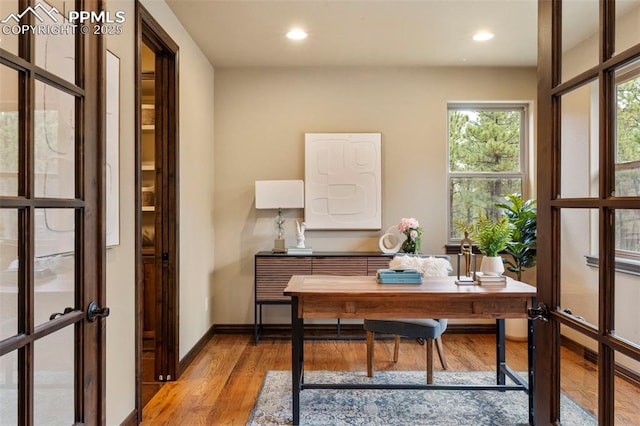 8395 Bar X Ter, Colorado Springs, CO 80908 - office area with light wood-type flooring, recessed lighting, baseboards, and french doors