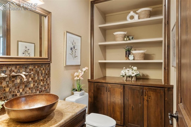 8395 Bar X Ter, Colorado Springs, CO 80908 - half bath featuring vanity and toilet
