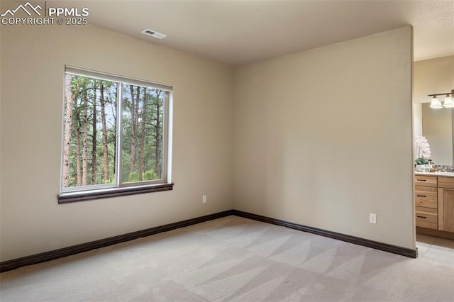 8395 Bar X Ter, Colorado Springs, CO 80908 - unfurnished room with light colored carpet and baseboards