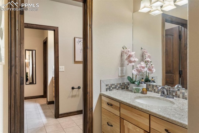 8395 Bar X Ter, Colorado Springs, CO 80908 - bathroom featuring vanity, tile patterned floors, and baseboards