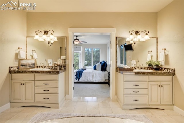 5085 Saxton Hollow Rd, Colorado Springs, CO 80908 - bathroom with ensuite bathroom, two vanities, and a chandelier