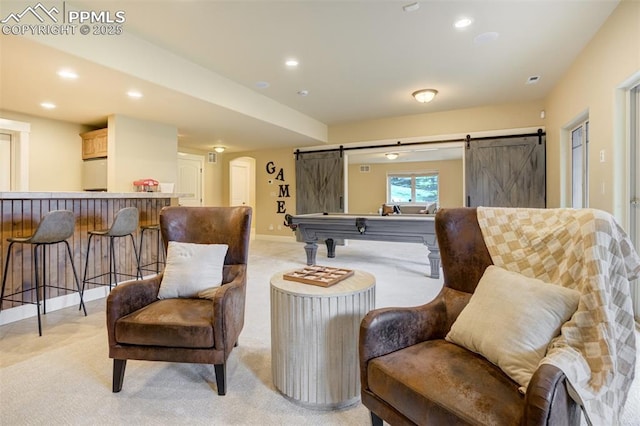 5085 Saxton Hollow Rd, Colorado Springs, CO 80908 - sitting room featuring a barn door, light colored carpet, billiards, recessed lighting, and arched walkways