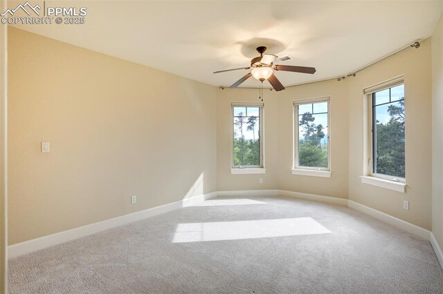 5085 Saxton Hollow Rd, Colorado Springs, CO 80908 - empty room with a ceiling fan and light colored carpet
