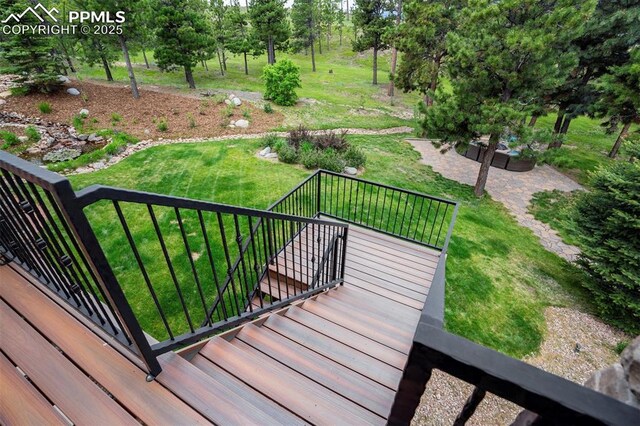 5085 Saxton Hollow Rd, Colorado Springs, CO 80908 - deck with a yard and a patio area