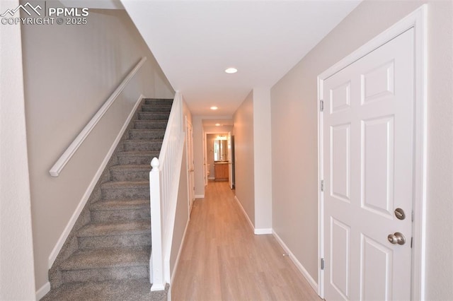 1160 Walters Pt, Monument, CO 80132 - stairs with recessed lighting, wood finished floors, and baseboards
