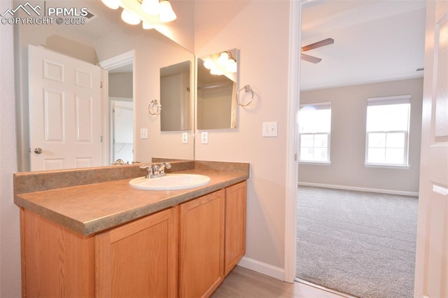 1160 Walters Pt, Monument, CO 80132 - bathroom with vanity, baseboards, and ceiling fan