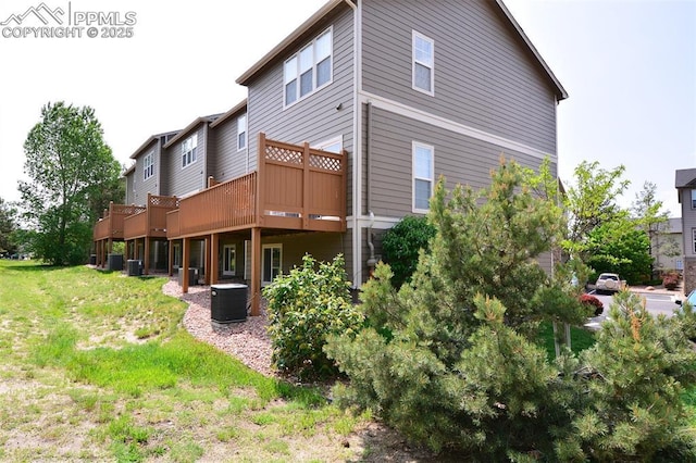 1160 Walters Pt, Monument, CO 80132 - rear view of property featuring central AC unit and a deck