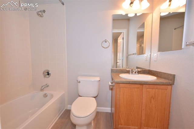1160 Walters Pt, Monument, CO 80132 - full bathroom with toilet,  shower combination, vanity, wood finished floors, and baseboards