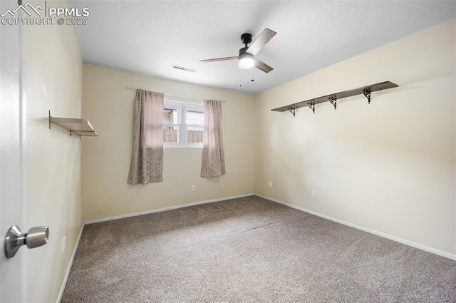 305 Rosewood Dr, Fountain, CO 80817 - unfurnished room featuring a ceiling fan, carpet, baseboards, and a textured ceiling