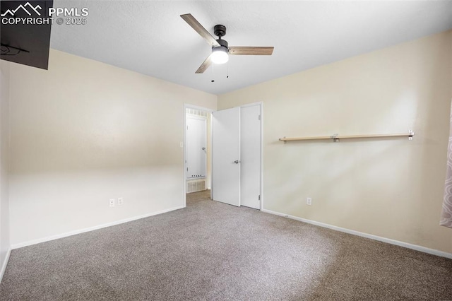 305 Rosewood Dr, Fountain, CO 80817 - unfurnished bedroom featuring carpet flooring, baseboards, and a ceiling fan