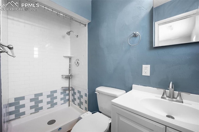 305 Rosewood Dr, Fountain, CO 80817 - bathroom with toilet, a tile shower, and vanity