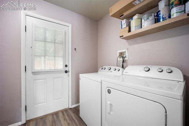 305 Rosewood Dr, Fountain, CO 80817 - washroom featuring washer and clothes dryer and wood finished floors