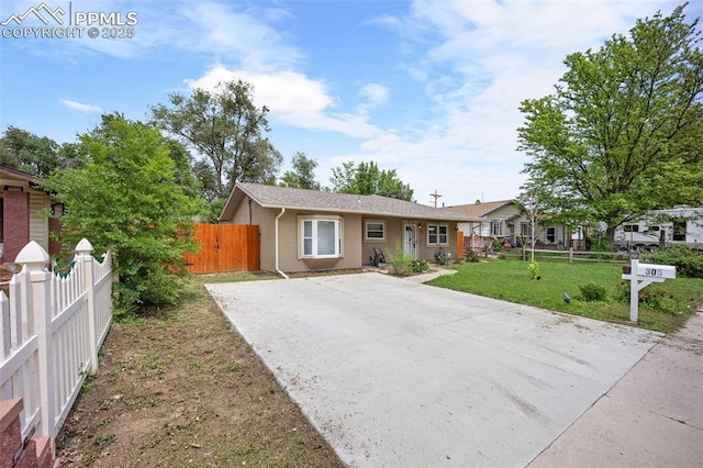 305 Rosewood Dr, Fountain, CO 80817 - ranch-style home featuring stucco siding and concrete driveway