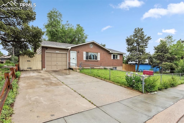 2123 Kodiak Dr, Colorado Springs, CO 80910 - ranch-style house featuring a garage, brick siding, and concrete driveway