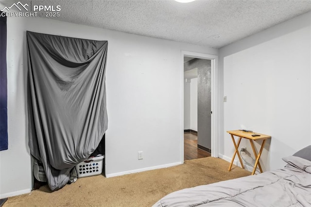 2123 Kodiak Dr, Colorado Springs, CO 80910 - bedroom with carpet flooring, a textured ceiling, and baseboards