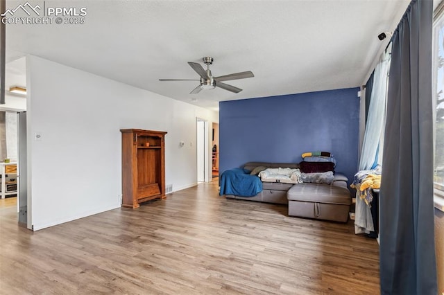 2123 Kodiak Dr, Colorado Springs, CO 80910 - sitting room with light wood-style floors, ceiling fan, and baseboards