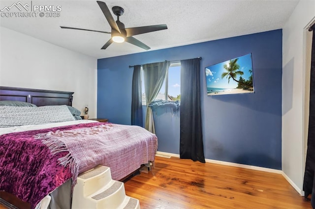 2123 Kodiak Dr, Colorado Springs, CO 80910 - bedroom with baseboards, wood finished floors, and a ceiling fan