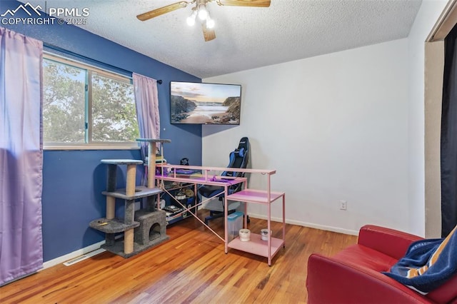 2123 Kodiak Dr, Colorado Springs, CO 80910 - office featuring a ceiling fan, a textured ceiling, wood finished floors, and baseboards