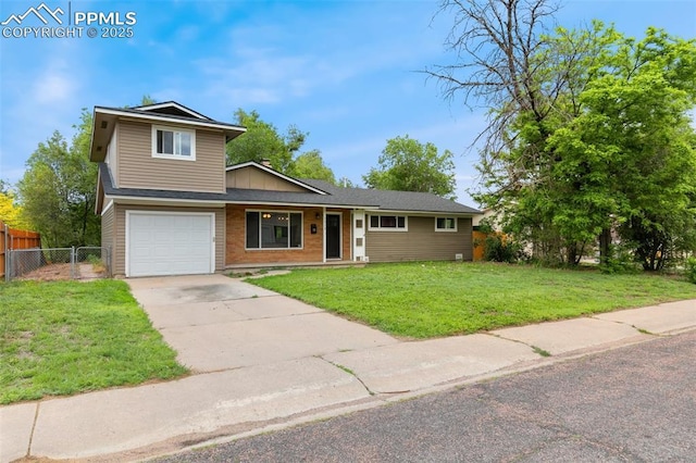 1513 Rosemont Dr, Colorado Springs, CO 80911 - view of front of home featuring driveway, an attached garage, brick siding, and covered porch