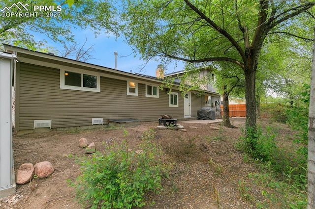 1513 Rosemont Dr, Colorado Springs, CO 80911 - back of house featuring an outdoor fire pit and a chimney
