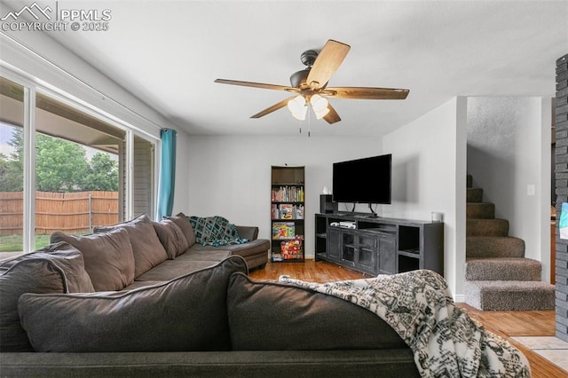 1513 Rosemont Dr, Colorado Springs, CO 80911 - living room with wood finished floors, a ceiling fan, and stairway