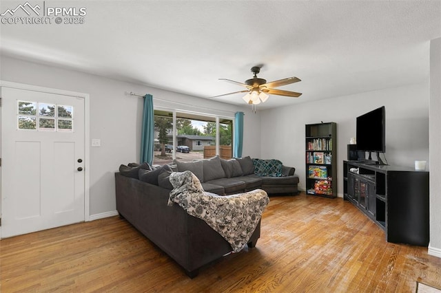 1513 Rosemont Dr, Colorado Springs, CO 80911 - living area featuring light wood finished floors, ceiling fan, and baseboards