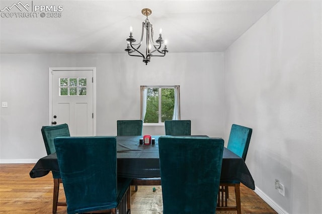 1513 Rosemont Dr, Colorado Springs, CO 80911 - dining room featuring a chandelier, baseboards, and wood finished floors