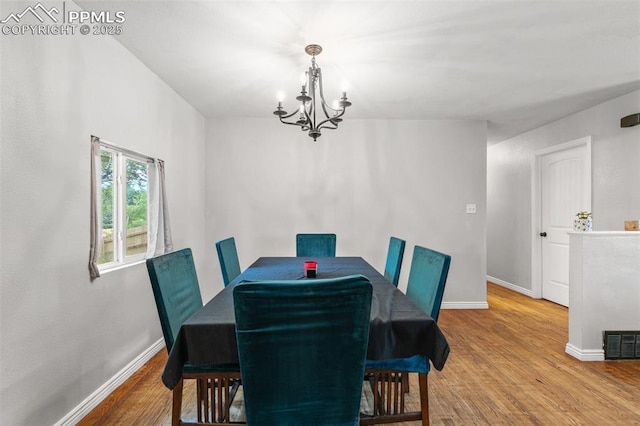 1513 Rosemont Dr, Colorado Springs, CO 80911 - dining space with a chandelier, baseboards, and wood finished floors