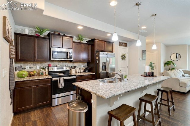 2001 Birmingham Loop, Colorado Springs, CO 80910 - kitchen featuring appliances with stainless steel finishes, a sink, dark wood-style flooring, backsplash, and recessed lighting