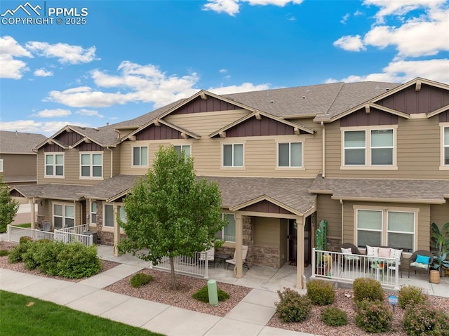 2001 Birmingham Loop, Colorado Springs, CO 80910 - multi unit property featuring outdoor lounge area, board and batten siding, and a shingled roof