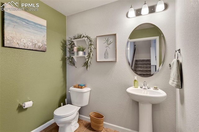 2001 Birmingham Loop, Colorado Springs, CO 80910 - half bathroom featuring toilet and baseboards