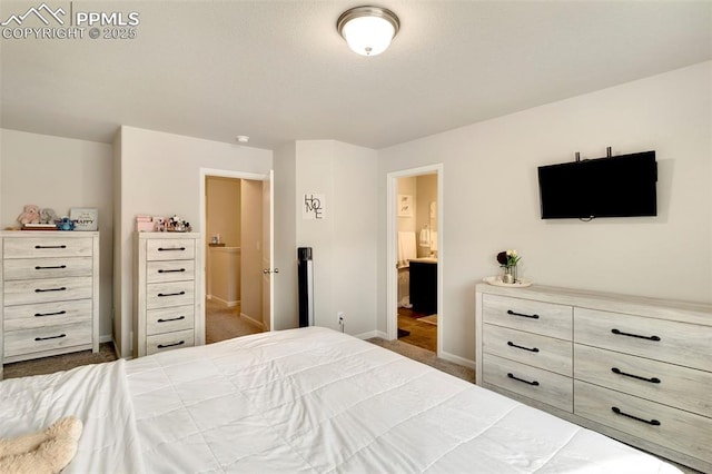 2001 Birmingham Loop, Colorado Springs, CO 80910 - carpeted bedroom with baseboards and ensuite bathroom