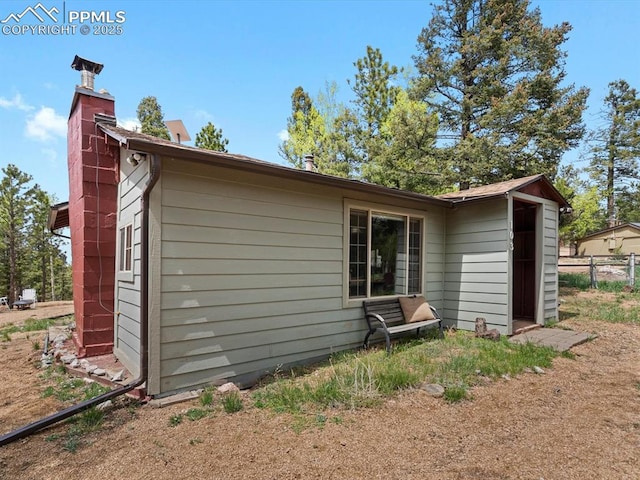 103 Alpine Rd, Woodland Park, CO 80863 - rear view of house with a chimney