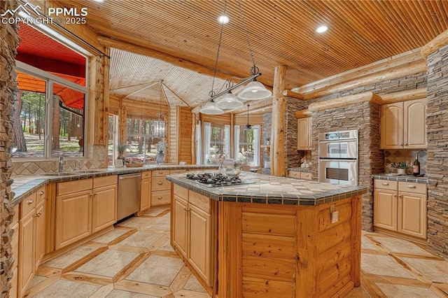 15975 Winding Trail Rd, Colorado Springs, CO 80908 - kitchen featuring stainless steel appliances, inlaid floor details, wooden ceiling, tile counters, and a kitchen island