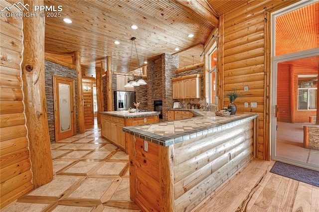 15975 Winding Trail Rd, Colorado Springs, CO 80908 - kitchen featuring stainless steel fridge with ice dispenser, log walls, a center island, recessed lighting, and wood ceiling