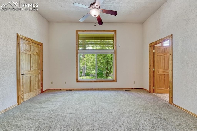 15975 Winding Trail Rd, Colorado Springs, CO 80908 - spare room featuring a textured wall, carpet flooring, a textured ceiling, and ceiling fan