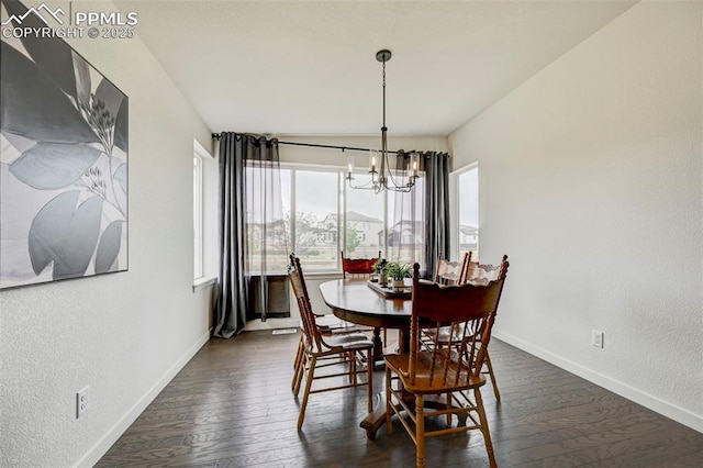 9276 Glitter Way, Colorado Springs, CO 80924 - dining room featuring a chandelier, baseboards, dark wood-style floors, and a textured wall